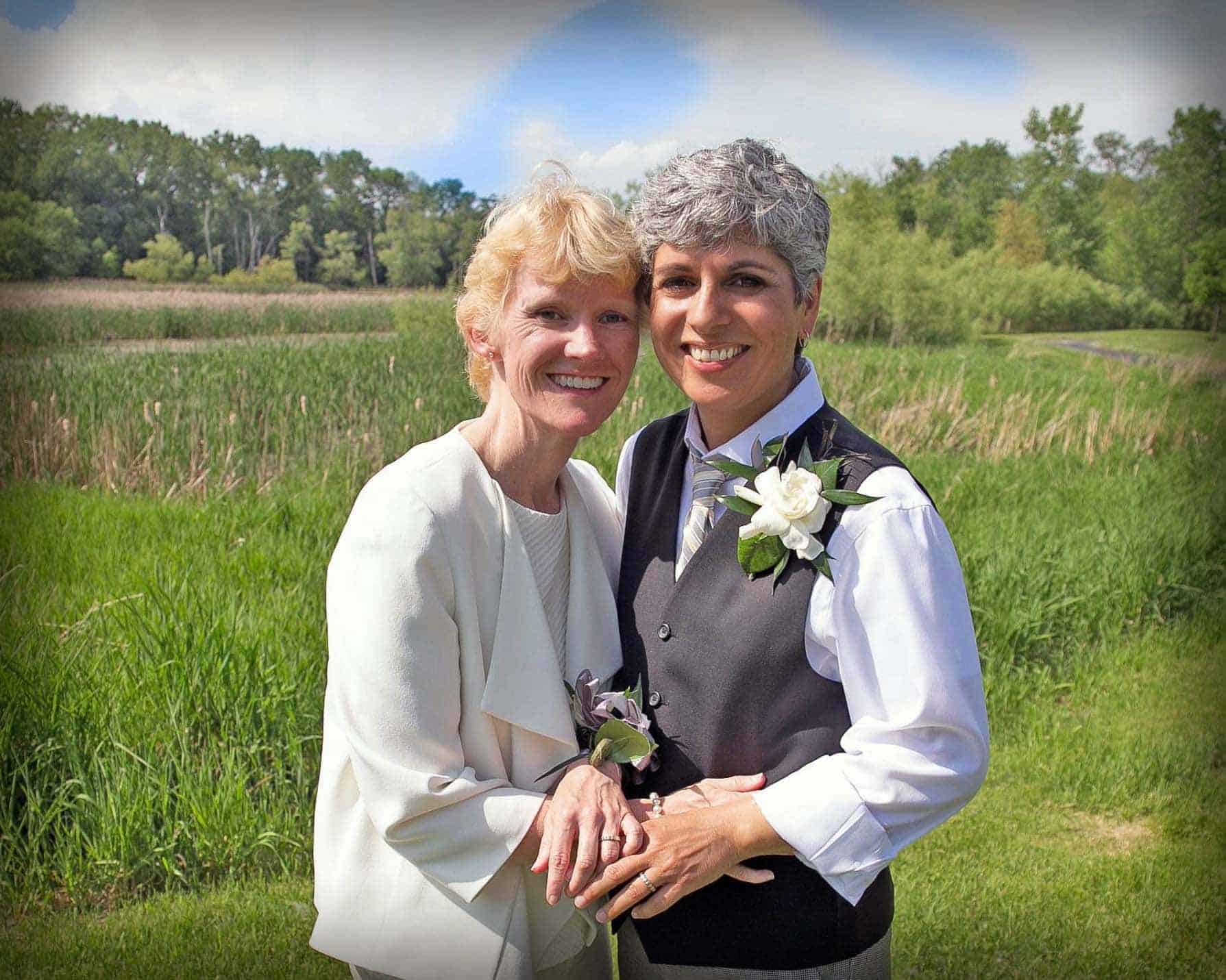 A photo of Dana and Laura at their wedding which was held outdoors because of their love of nature. That love of nature was a big part of why a Memorial Tree at Better Place Forests felt like the right fit.