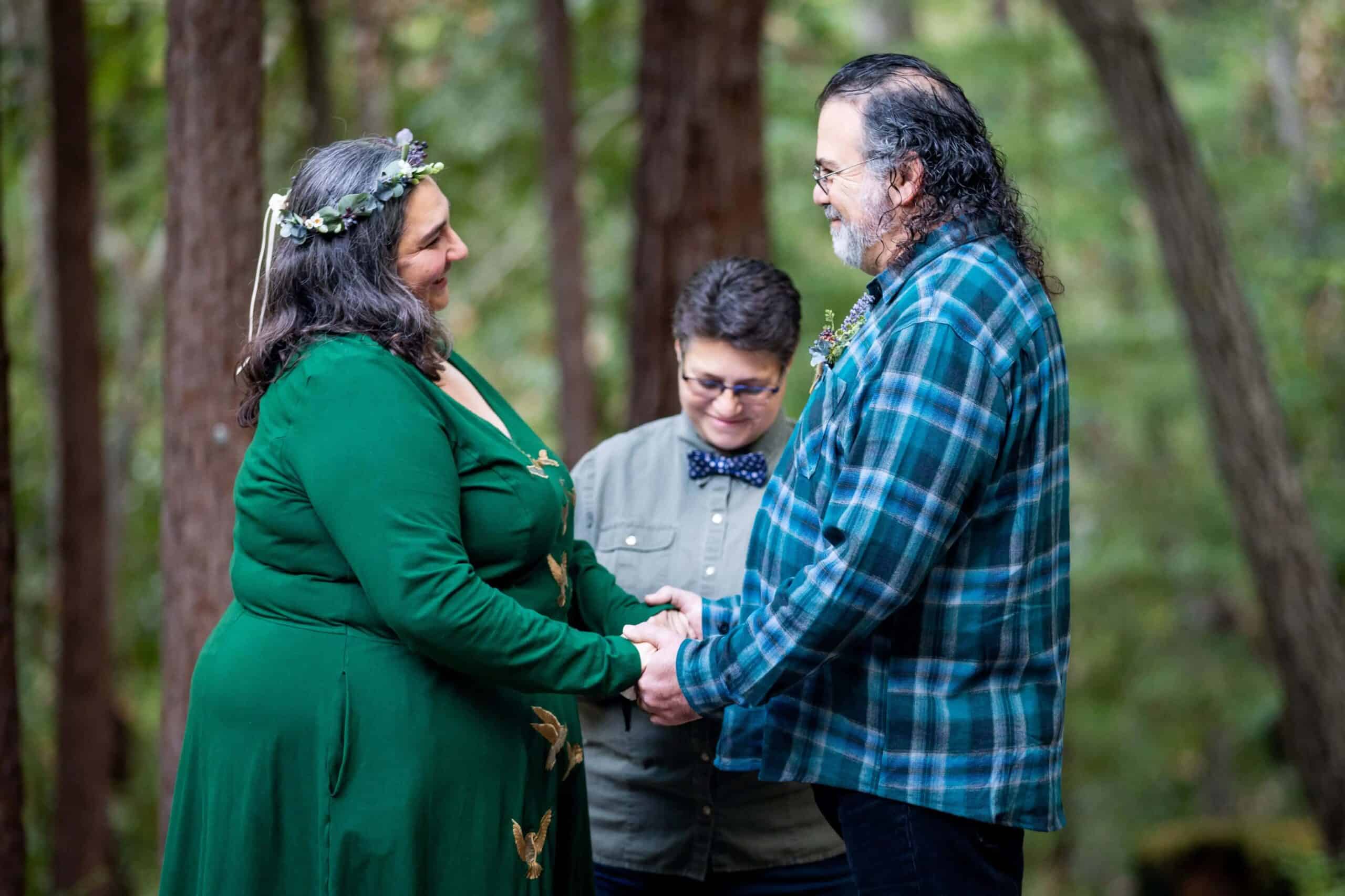 Kathryn and Joey stand at their memorial tree to have a forest wedding