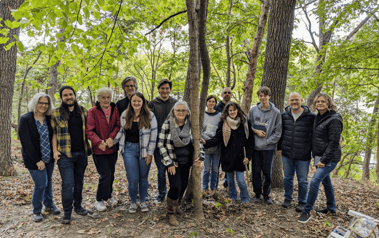 a family stands by a memorial tree for their loved one in better place forests rock river to create new traditions together