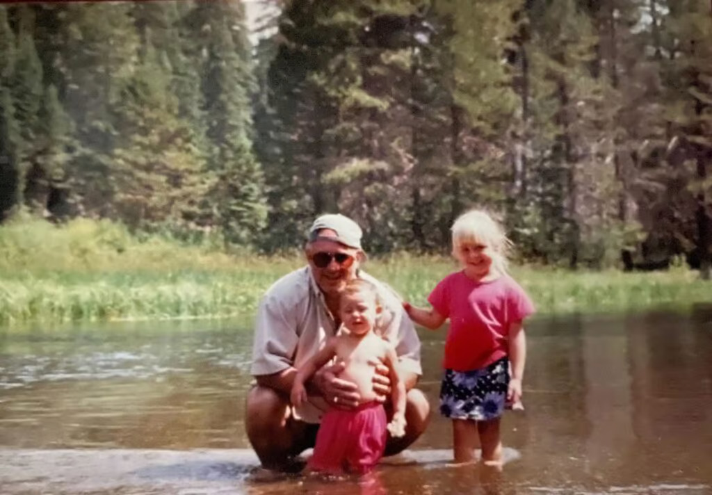 old photo of womans father when she was a child at his forest memorial