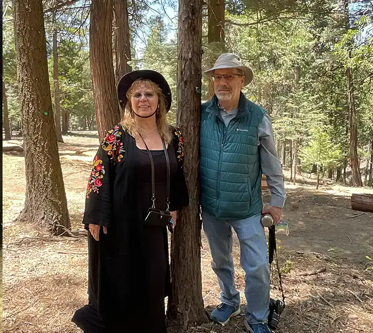 executor and her husband at memorial tree