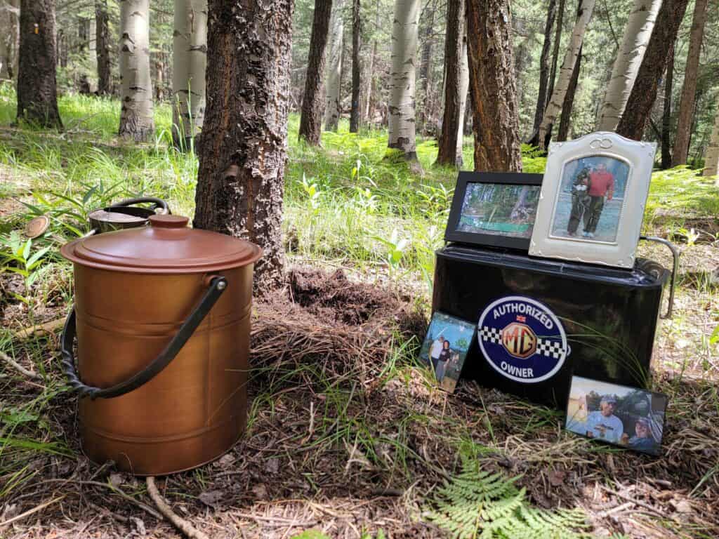 memorial tree with vessel and pictures of womans loved one