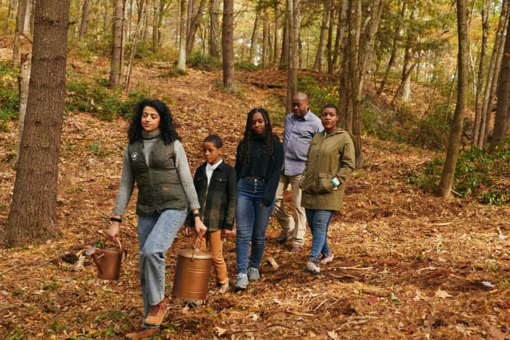 a family walks to their memorial tree in litchfield hills